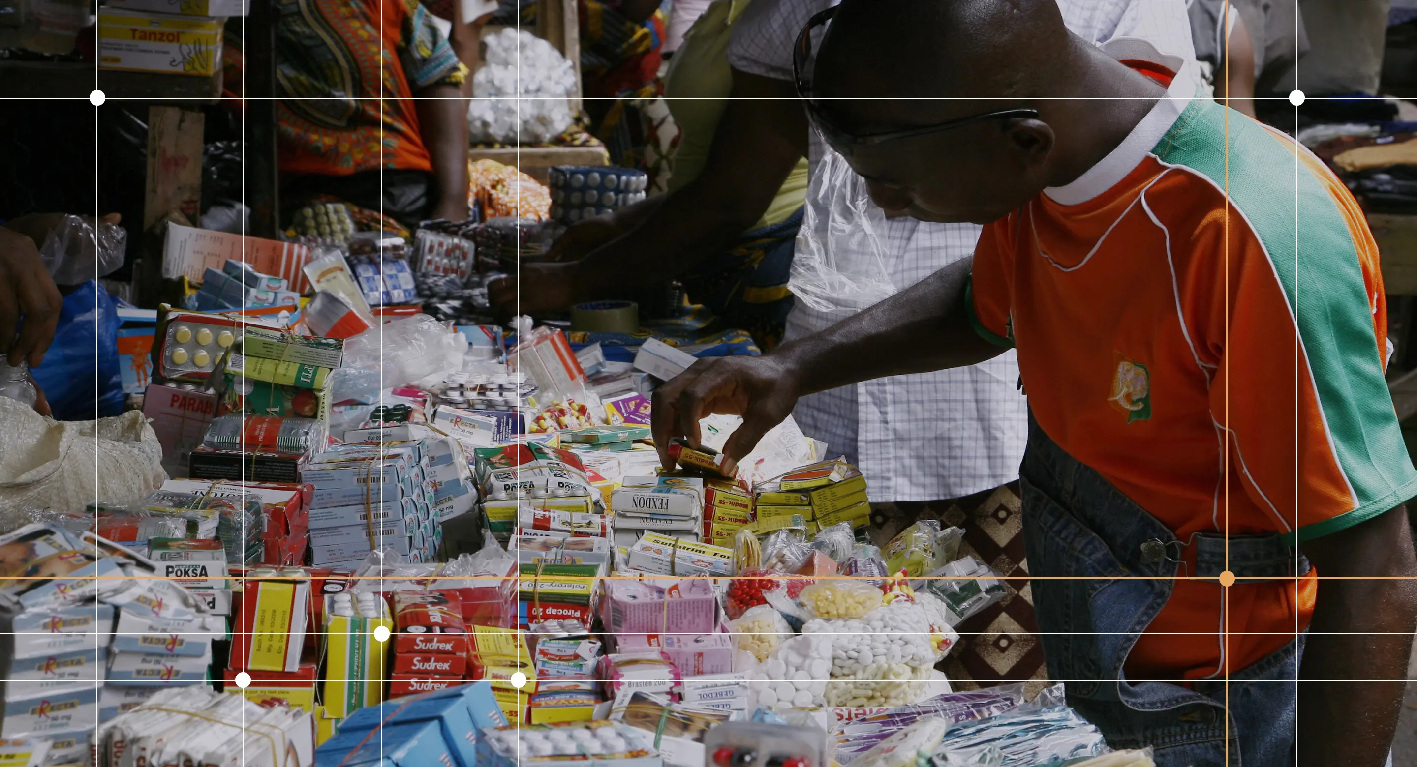A man buys smuggled and/or counterfeit medicine Adjame market in Abidjan